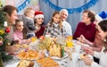 family talking animatedly during Christmas dinner