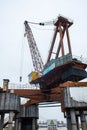 Large harbor crane on top of a structure in Wuhan