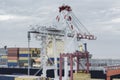 Large harbour crane loading containers on a cargo vessel Royalty Free Stock Photo