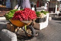 Large heap of fresh radish vegetable displayed on street in wheelbarrow - fruit and vegetables are usually sold on streets at Royalty Free Stock Photo