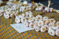 Large heap of fresh ripe organic garlic on farmer market in Cucuron, France