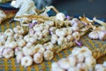 Large heap of fresh ripe organic garlic on farmer market in Cucuron, France