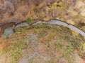 The large heap garbage dump extends parallel to the river,Garbage mountains with cloudy sky back ground in day light Royalty Free Stock Photo