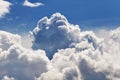 Large heapy white clouds against the backdrop of the endless blue sky Royalty Free Stock Photo