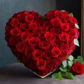 A large heart arranged with red rose flowers. Heart as a symbol of affection and