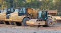 Large heavy construction trucks at a building site. Royalty Free Stock Photo