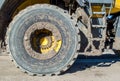 Large heavy duty tire and metal steps caked with mud