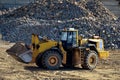 Large heavy front-end loader or all-wheel bulldozer for mechanization of loading, digging and excavation operations in open quarry
