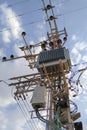 Large high-voltage electric pole top transformer on the background of the sky Royalty Free Stock Photo