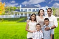 Large Hispanic Family in Front of Their New Home Royalty Free Stock Photo