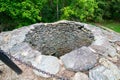 A Large Cobblestone Hole With a Metal Covering Over the Top at the Historic Lock 12 In Pennsylvania