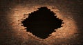 Broken Brick Wall Hole A large hole in a red brick wall illuminated by a spotlight creates a dramatic and textured background Royalty Free Stock Photo