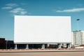 Large horizontal billboard mockup with blank empty copy space for inserting text, by the roadside in a city in the daytime Royalty Free Stock Photo