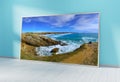 Large horizontal frame leaning on a blue wall 3D rendering Royalty Free Stock Photo