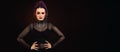 Large horizontal image Woman with halloween makeup on dark backgroundcolored, looking to the side, goth feel, space for copy