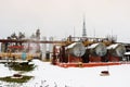 Large horizontal shell-and-tube tanks heat exchangers with liquid at an industrial petroleum refining petrochemical chemical plant