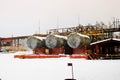 Large horizontal shell-and-tube tanks heat exchangers with liquid at an industrial petroleum refining petrochemical chemical plant