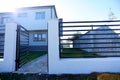 House with opened gates, exterior view