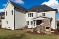 A large house with landscaped backyard