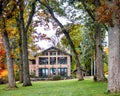 House with Fall Trees, Lake Geneva Shorepath Royalty Free Stock Photo