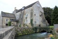 Large house with Water mill in english rural village Royalty Free Stock Photo