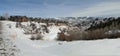 Large houses overlook snowy valley