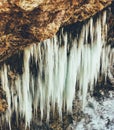 Large ice icicles on a rock Royalty Free Stock Photo