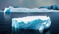 Large iceberg melting into the ocean. Concept of global warming, ecology and environment. Royalty Free Stock Photo