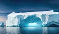 Large iceberg melting into the ocean. Concept of global warming, ecology and environment. Royalty Free Stock Photo