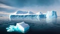 Large iceberg melting into the ocean. Concept of global warming, ecology and environment. Royalty Free Stock Photo