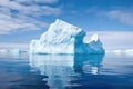 large iceberg surrounded by chunks of floating ice