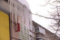 Large iced icicles hanging from the roof of the house