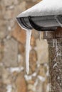 Large Icicle Hanging from a Gutter in Ireland Royalty Free Stock Photo