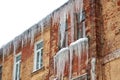 Large icicles on the facade of the building