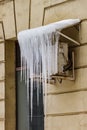 Large icicles hang on the air conditioner canopy