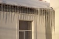 Large icicles on the roof of the school are a big danger for children and adults.