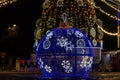 Large illuminated Christmas bauble on city square