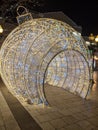 A large illuminated Christmas ornament at city center