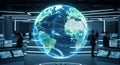 Futuristic office with illuminated global network globe surrounded by computer monitors and professionals working in modern Royalty Free Stock Photo