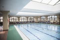 Large, indoor swimming pool with skylight.