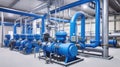 Large industrial boiler room and water treatment facility, blue pumps, shiny stainless metal pipes, and valves Royalty Free Stock Photo