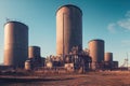 a large industrial building with three large towers on top of it\'s sides and a dirt field in front of it