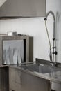 Large industrial kitchen dishwasher and sink all stainless steel Royalty Free Stock Photo