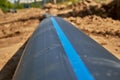 Large industrial black plastic polypropylene water pipe on the construction site for laying water pipes, construction Royalty Free Stock Photo