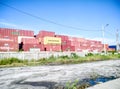 Large industrial Texas Line container near a railway