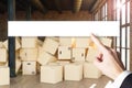 Large industrial urban warehouse with large pile of cardboard moving boxes finger pointing on search bar, conceptual 3D