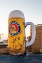 A large inflated beer mug with the emblem of the Paulaner beer company stands at the Beer Festival on the embankment of the Nahari