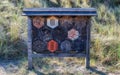 Large insect hotel with eleven different compartments Royalty Free Stock Photo