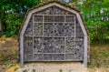 Large insect hotel in the forest, shelter for the bees and other insects