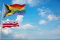 large Inter Progress Pride flag and flag of the District of Columbia state, USA waving at sky. Freedom and love, activism,